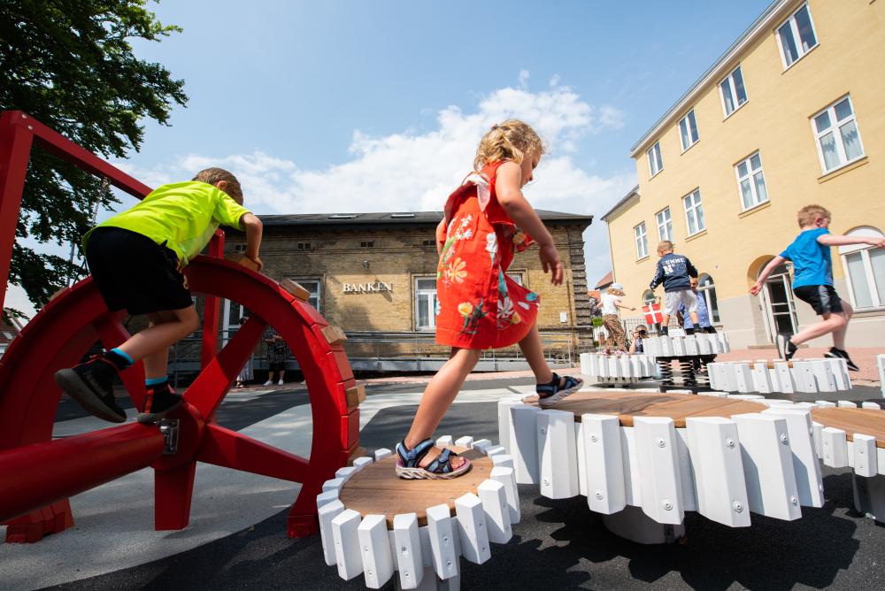 Girl jumping on playground, MONSTRUM playgrounds